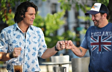 Joe Nichols (l) and video director Potsy Ponciroli share a fist bump during a break in filming.