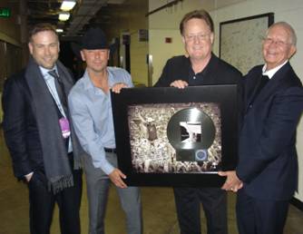 Pictured: (l-r) Clint Higham (President Morris Management Group), Chesney, Gary Overton (Chairman & CEO Sony Music Nashville), D