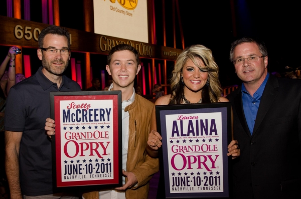 Scotty and Lauren received show prints commemorating their Opry debuts.
