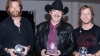 Brooks & Dunn and Dierks Bentley after presenting a CMA International Artist Achievement Award