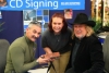Anderson And Tippin Sign One Of The Bricks From Destroyed School