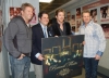 Fred Nelson, president of People's Choice, and Rascal Flatts hold the People's Choice winning album design.